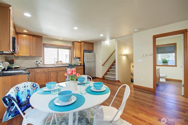 2509NE 125th St, Seattle, WA 98125 - dining room featuring stairs, wood finished floors, baseboards, and recessed lighting