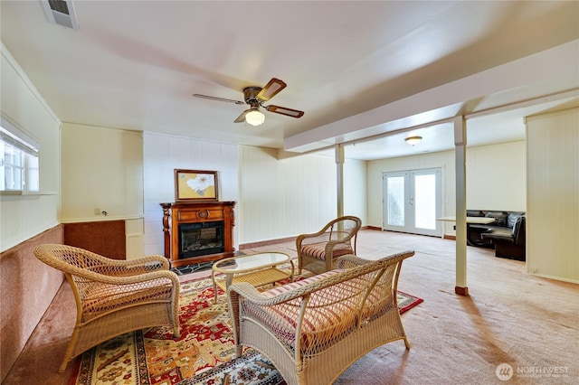 26421 Kingsview Loop NE, Kingston, WA 98346 - living area with a fireplace, light colored carpet, french doors, and a ceiling fan