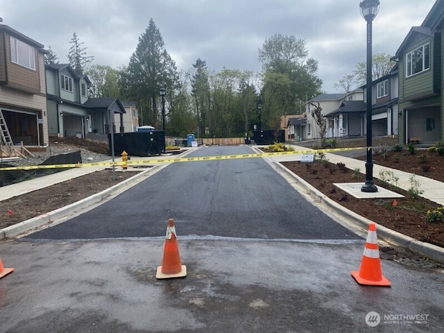 17012 106th Ave SE Lot 1, Renton, WA 98058 - view of asphalt road with a residential view, street lighting, and curbs