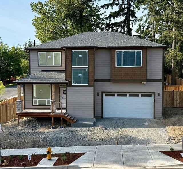 17012 106th Ave SE Lot 1, Renton, WA 98058 - view of front of home featuring a garage, gravel driveway, and roof with shingles