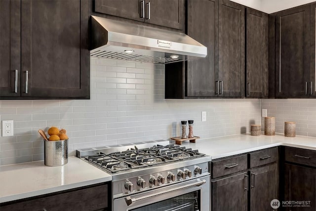 17012 106th Ave SE Lot 1, Renton, WA 98058 - kitchen featuring high end stove, under cabinet range hood, decorative backsplash, dark brown cabinets, and light countertops