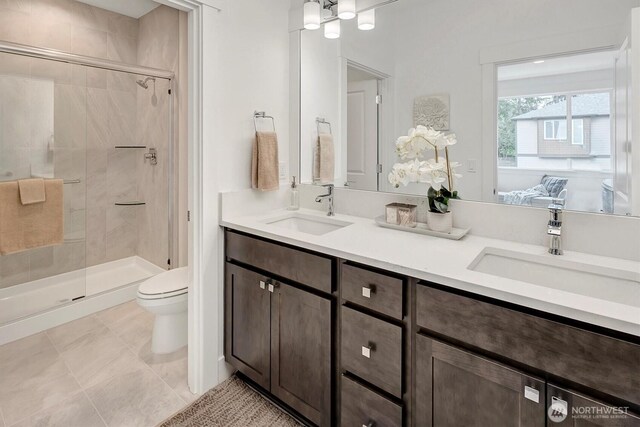 17012 106th Ave SE Lot 1, Renton, WA 98058 - bathroom featuring a stall shower, double vanity, and tile patterned floors