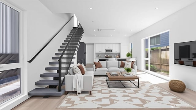 1114 26th Ave Unit A, Seattle, WA 98122 - living room with stairs, light wood-type flooring, and recessed lighting