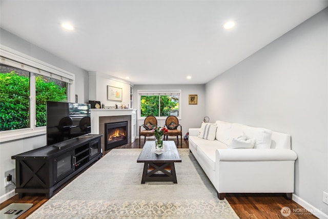 15068 NE 13th St, Bellevue, WA 98007 - living area with wood finished floors, recessed lighting, and a warm lit fireplace