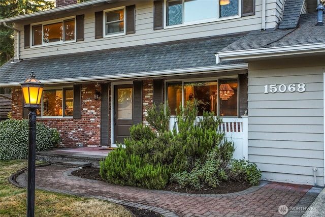 15068 NE 13th St, Bellevue, WA 98007 - doorway to property with brick siding, covered porch, and a chimney