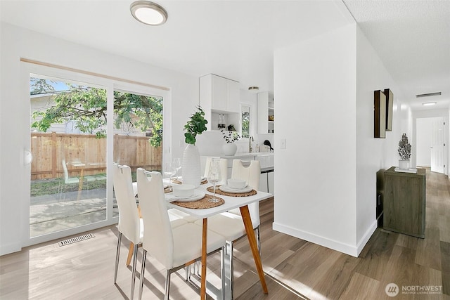 25035 34th Ave S, Kent, WA 98032 - dining room with wood finished floors and baseboards