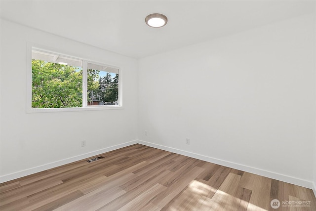 25035 34th Ave S, Kent, WA 98032 - spare room with baseboards and wood finished floors