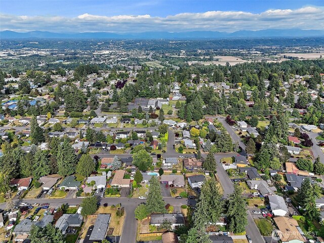 25035 34th Ave S, Kent, WA 98032 - aerial view of property's location featuring a mountainous background and nearby suburban area