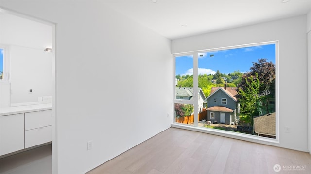 1114 26th Ave Unit B, Seattle, WA 98122 - empty room with light wood-style floors and recessed lighting