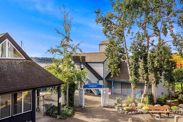 6155 NE 175th St Unit 110, Kenmore, WA 98028 - view of home's exterior with a shingled roof