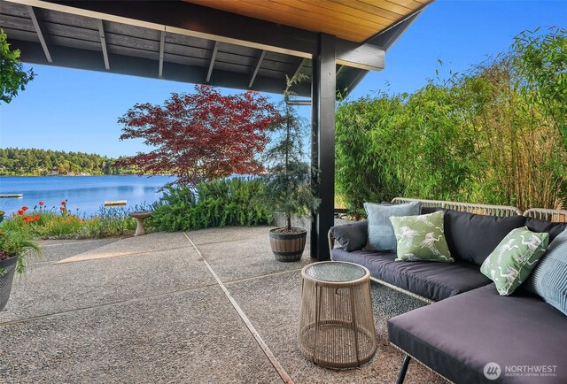 9707 SW Quartermaster Dr, Vashon, WA 98070 - view of patio / terrace with an outdoor living space, a water view, and a wooded view