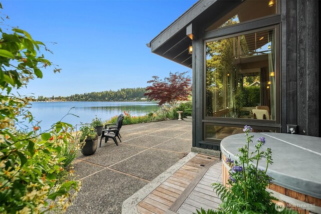 9707 SW Quartermaster Dr, Vashon, WA 98070 - view of patio / terrace with a water view