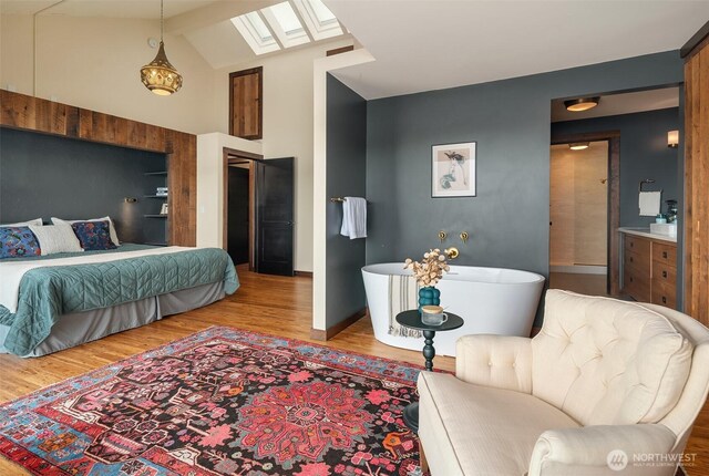 9707 SW Quartermaster Dr, Vashon, WA 98070 - bedroom featuring a skylight, wood finished floors, and lofted ceiling