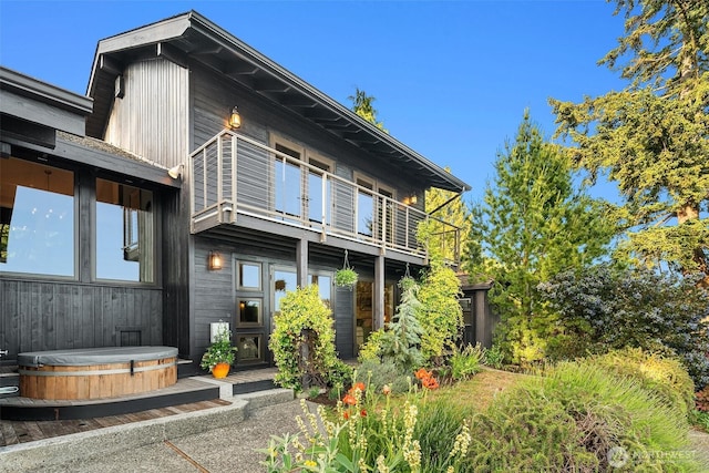 9707 SW Quartermaster Dr, Vashon, WA 98070 - back of property featuring a covered hot tub and a balcony