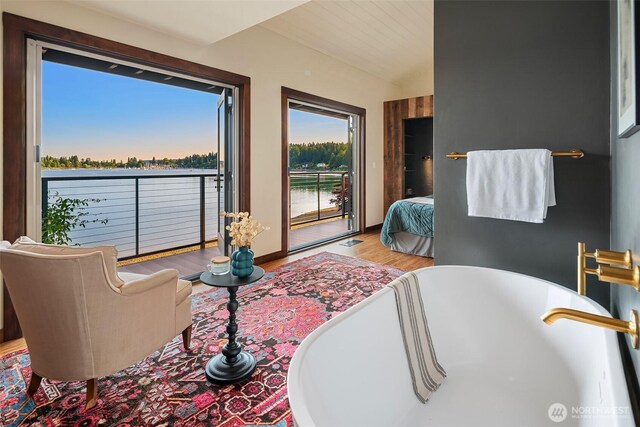 9707 SW Quartermaster Dr, Vashon, WA 98070 - living area featuring wood finished floors and lofted ceiling