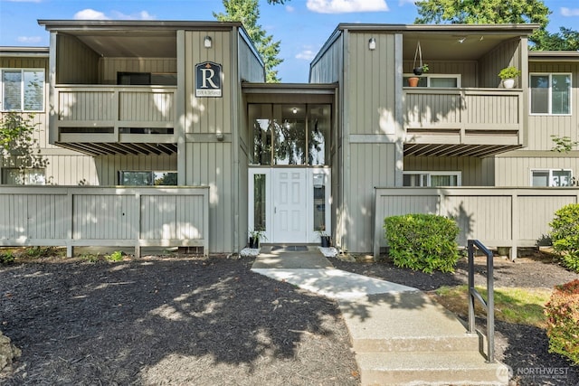 1506 N Defiance St Unit R205, Tacoma, WA 98406 - view of front facade featuring a balcony and board and batten siding