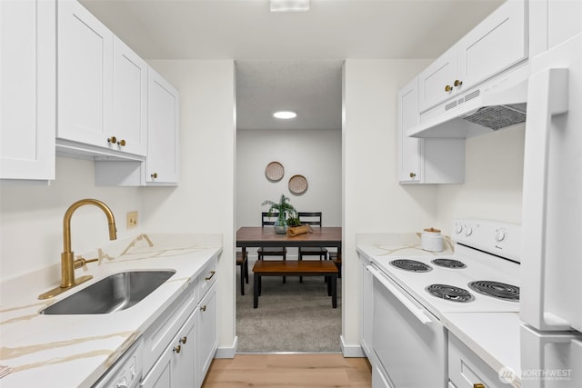1506 N Defiance St Unit R205, Tacoma, WA 98406 - kitchen featuring white appliances, under cabinet range hood, white cabinetry, and light wood-type flooring