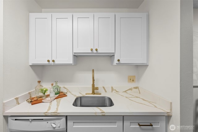1506 N Defiance St Unit R205, Tacoma, WA 98406 - kitchen with dishwashing machine, light stone counters, and white cabinetry