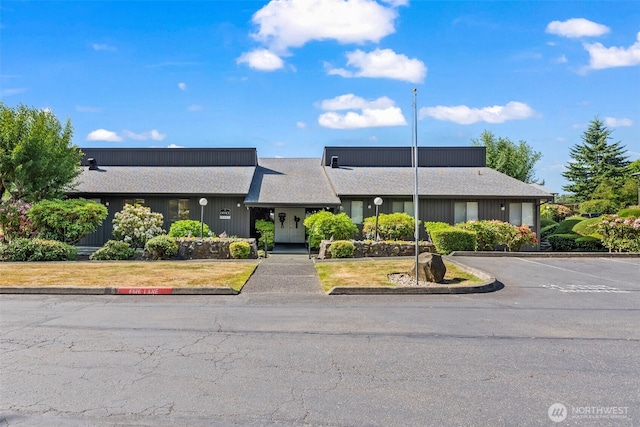 1506 N Defiance St Unit R205, Tacoma, WA 98406 - view of building exterior featuring uncovered parking