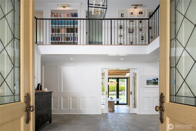 8580 Hunts Point Ln, Hunts Point, WA 98004 - foyer featuring a chandelier and a towering ceiling