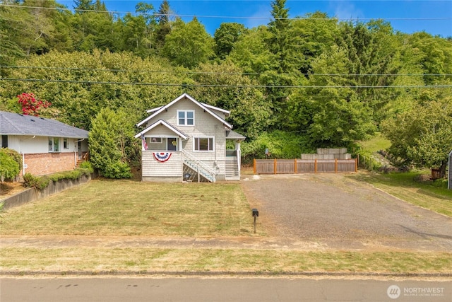 113 W Chenault Ave, Hoquiam, WA 98550 - view of front of house with a wooded view and stairway