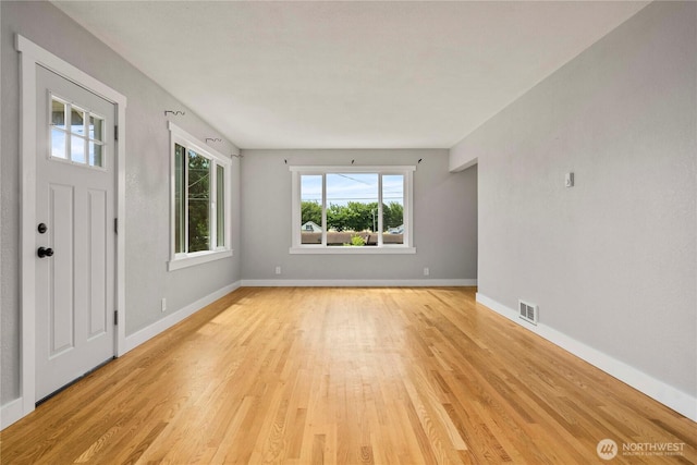 113 W Chenault Ave, Hoquiam, WA 98550 - foyer with healthy amount of natural light, light wood-style floors, and baseboards