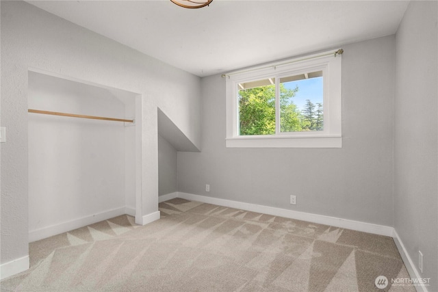 113 W Chenault Ave, Hoquiam, WA 98550 - unfurnished bedroom with carpet floors, baseboards, and a closet