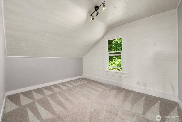 113 W Chenault Ave, Hoquiam, WA 98550 - additional living space featuring vaulted ceiling, baseboards, and carpet flooring