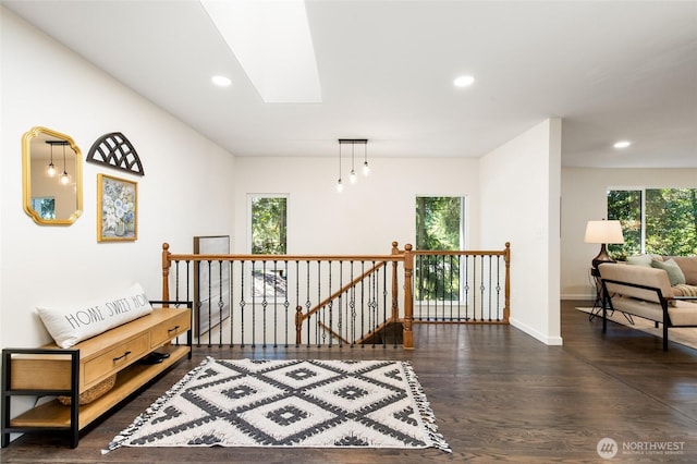 604 N 178th St, Shoreline, WA 98133 - hallway with an upstairs landing, dark wood-type flooring, recessed lighting, baseboards, and a skylight
