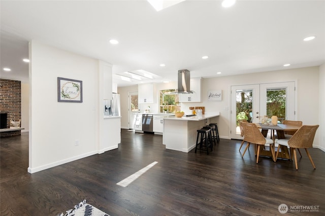 604 N 178th St, Shoreline, WA 98133 - dining space featuring french doors, dark wood finished floors, recessed lighting, baseboards, and a fireplace