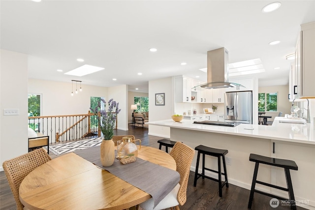 604 N 178th St, Shoreline, WA 98133 - dining area featuring a skylight, dark wood-style flooring, healthy amount of natural light, and recessed lighting