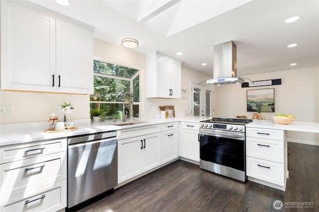 604 N 178th St, Shoreline, WA 98133 - kitchen with stainless steel appliances, island range hood, a sink, a peninsula, and dark wood-style floors