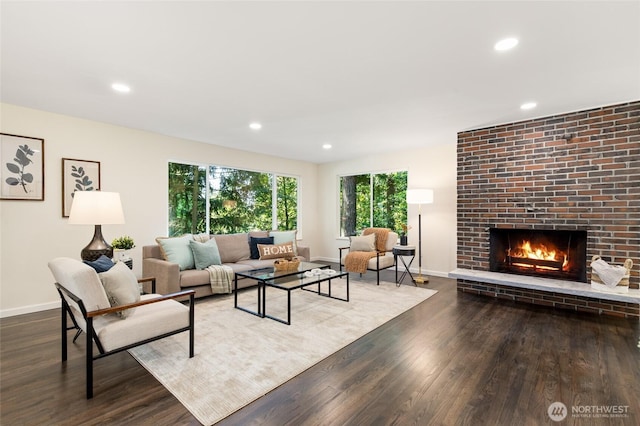 604 N 178th St, Shoreline, WA 98133 - living room featuring wood finished floors, baseboards, a fireplace, and recessed lighting