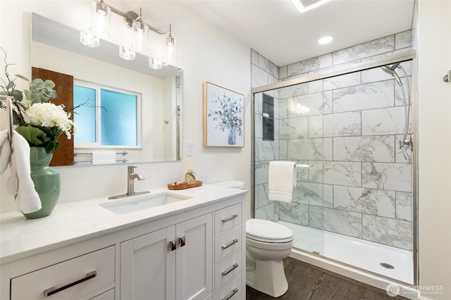 604 N 178th St, Shoreline, WA 98133 - full bathroom with toilet, vanity, a shower stall, and wood finished floors