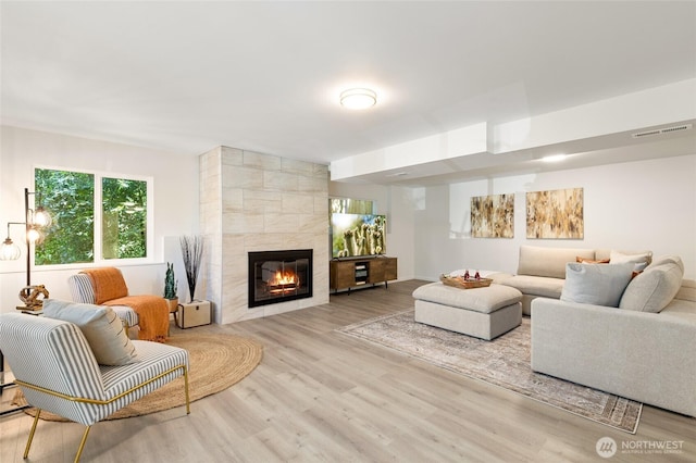 604 N 178th St, Shoreline, WA 98133 - living room featuring wood finished floors and a tile fireplace