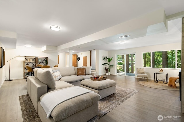 604 N 178th St, Shoreline, WA 98133 - living area featuring baseboards, light wood-type flooring, and ornate columns