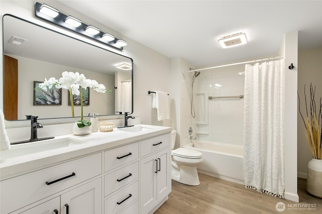 604 N 178th St, Shoreline, WA 98133 - bathroom with toilet, double vanity, wood finished floors, and shower / tub combo with curtain