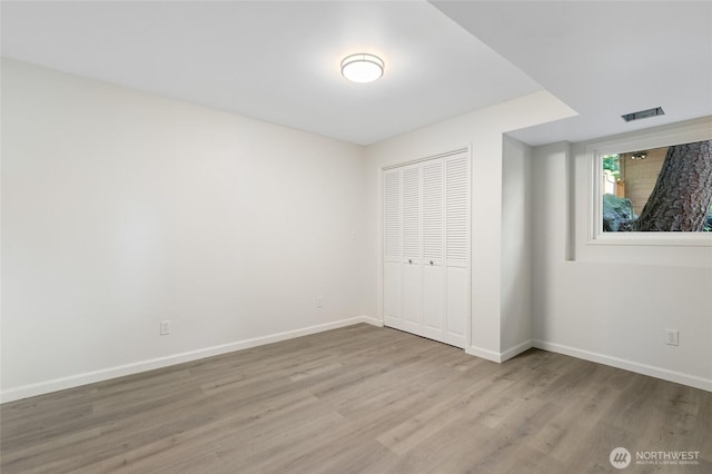 604 N 178th St, Shoreline, WA 98133 - unfurnished bedroom featuring wood finished floors, baseboards, and a closet