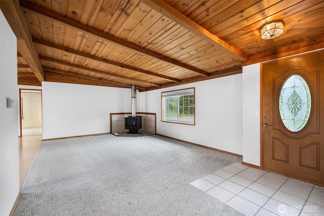 14803 SE 306th St, Kent, WA 98042 - foyer with a wood stove, light colored carpet, wood ceiling, and baseboards