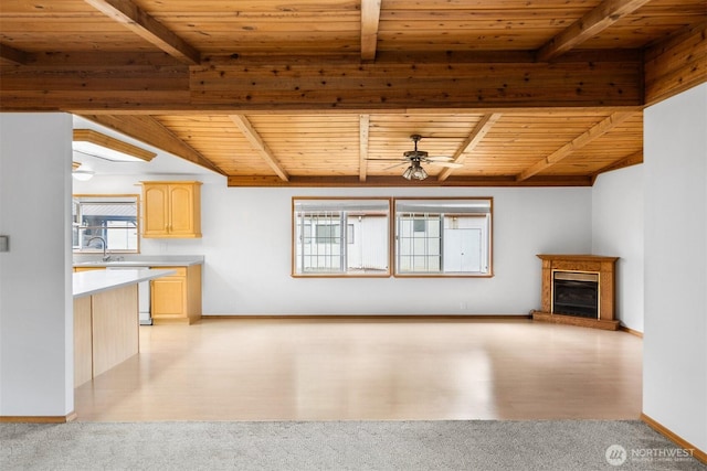 14803 SE 306th St, Kent, WA 98042 - unfurnished living room with wood ceiling, healthy amount of natural light, a ceiling fan, a fireplace with raised hearth, and light carpet