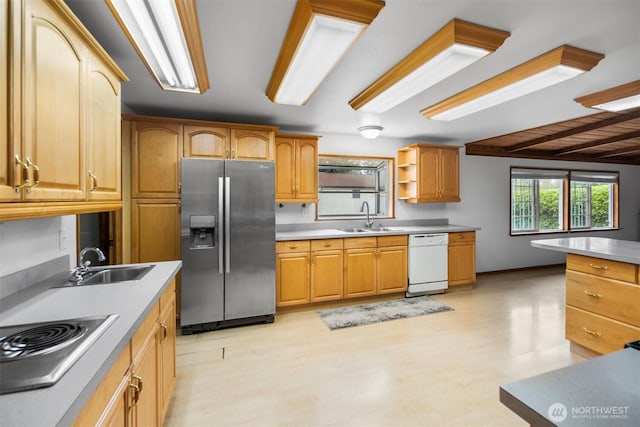 14803 SE 306th St, Kent, WA 98042 - kitchen with stainless steel appliances, a sink, light floors, light countertops, and beam ceiling