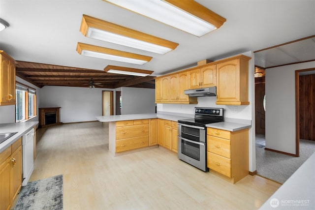 14803 SE 306th St, Kent, WA 98042 - kitchen featuring range with two ovens, under cabinet range hood, white dishwasher, a ceiling fan, and a peninsula