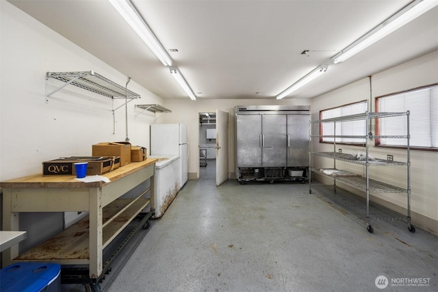 14803 SE 306th St, Kent, WA 98042 - garage with a workshop area and freestanding refrigerator