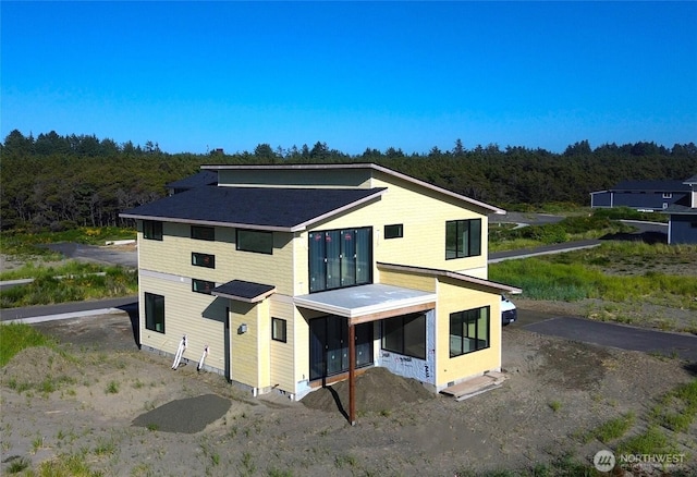 1421 S Cohasset Crst, Westport, WA 98595 - rear view of house with a forest view