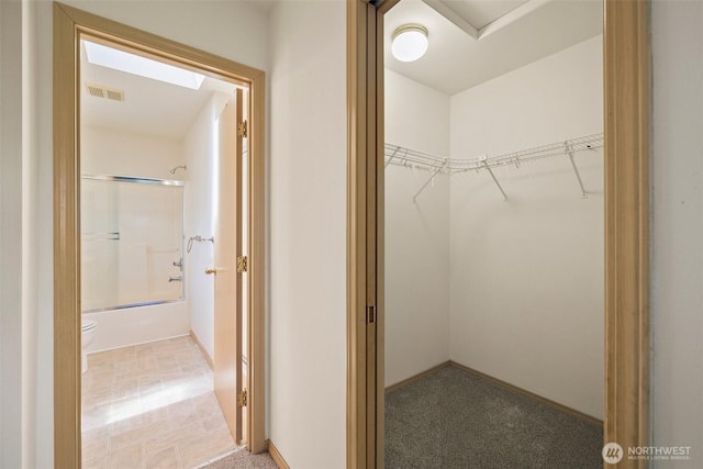 10040 19th Ave SW, Seattle, WA 98146 - walk in closet featuring a skylight