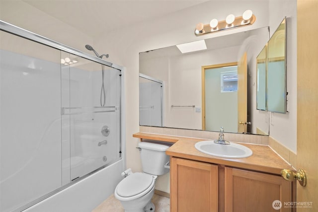 10040 19th Ave SW, Seattle, WA 98146 - full bathroom featuring vanity, toilet, bath / shower combo with glass door, a skylight, and tile patterned flooring