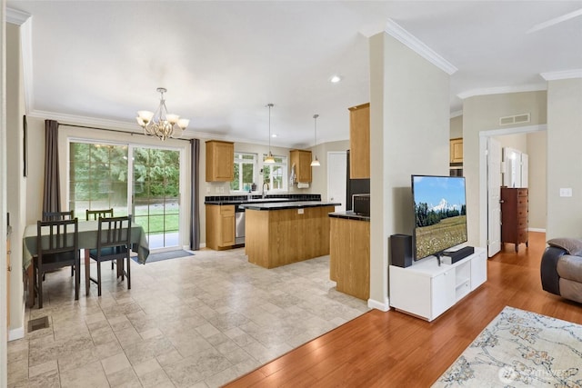 6098 Mt Baker Hwy, Deming, WA 98244 - kitchen featuring a chandelier, a center island, crown molding, dark countertops, and open floor plan