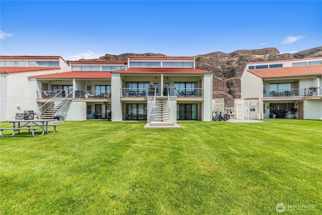 8903 Crescent Bar Rd NW Unit 18, Quincy, WA 98848 - view of building exterior featuring stairway and a mountain view