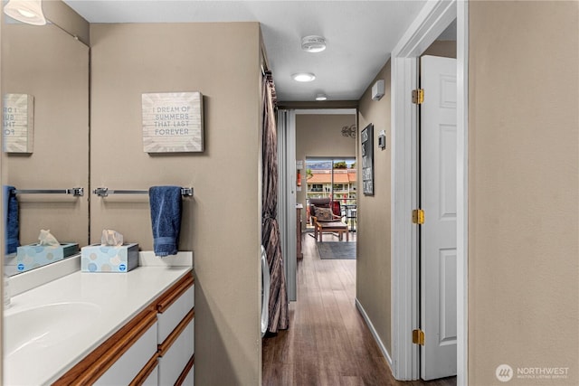 8903 Crescent Bar Rd NW Unit 18, Quincy, WA 98848 - bathroom featuring vanity, wood finished floors, and baseboards