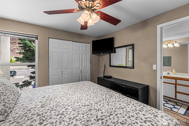 8903 Crescent Bar Rd NW Unit 18, Quincy, WA 98848 - bedroom featuring wood finished floors, electric panel, ceiling fan, and a closet